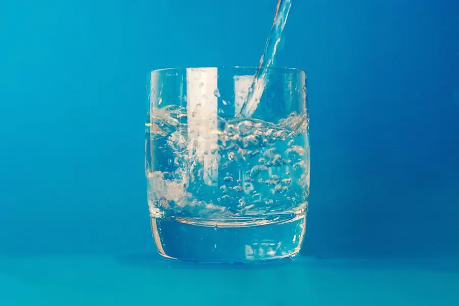 Clear water being poured into a glass